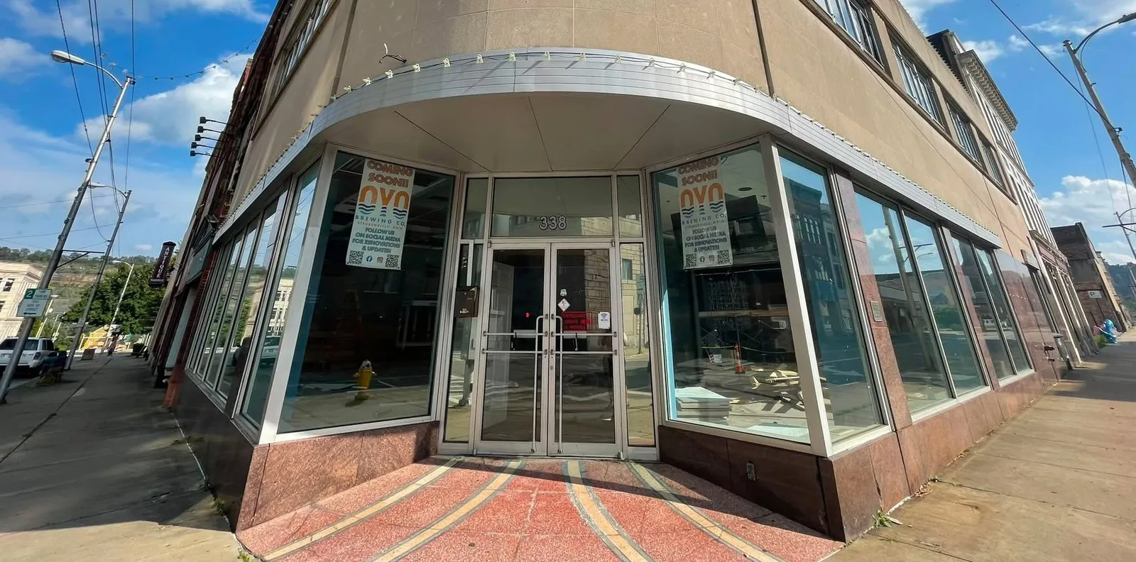 Street-level entrance of the future Oyo Brewing Co. taproom at 338 Market Street, with Coming Soon signage in the windows